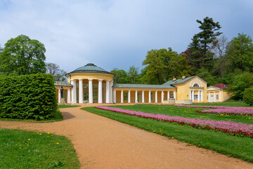 Small colonnade in Marianske Lazne (Marienbad) - spring in spa park. Spa architecture - colonnade of cold mineral water spring Ferdinand - Czech Republic, Europe