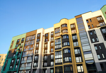Fototapeta premium Residential condominium building. Modern complex of Apartment residential condo. Residential architecture exterior. Modern facade building. New House, Eco-friendly residential building.