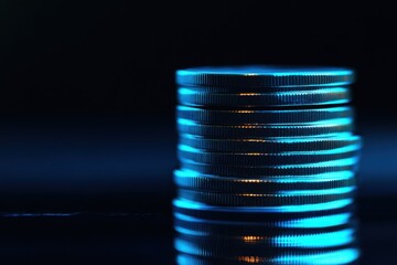 Coins stack financial chart glowing blue lines dark background