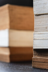 stack of old books on a table, closed up, background and texture