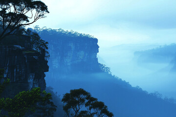 Misty mountains and cliffs at dawn in a serene landscape