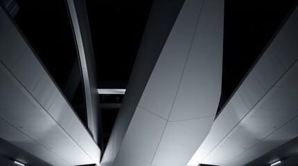 Fototapeta premium Architectural Abstract: Night view of a modern bridge's underside, showcasing sleek lines and dramatic shadows. A study in geometric forms and contrasting light. 