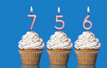 Birthday Cupcakes With Candles Lit Forming The Number 756