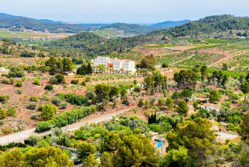 Farmhouse in Countryside. Spanish Farm. Family Villa in a Farmer Field. Rural landscape in Spain. Spain olive farm field. Farm House in Spain village, aerial view. Finca with trees in countryside.