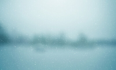 Icy snowy winter landscape background with falling snow - Festive christmas holiday seasonal outdoor nature backdrop in white and blue, a sparkling glittering ethereal light stylish abstract banner