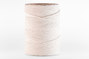 Close-up of natural white rope neatly wound into a coil