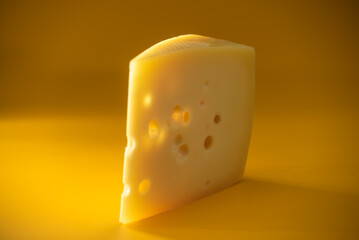 Chunks of Maasdam Dutch cow's milk cheese.
A piece of yellow cheese.