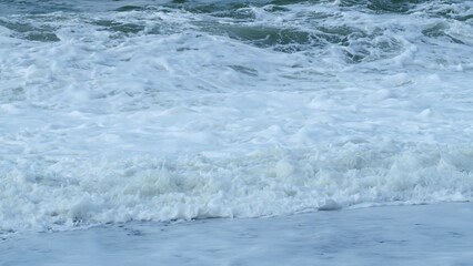 Fototapeta premium Storm Wave In Sea. Dark Sea Ocean Surface. Splashes Of Water From Waves Breaking. Slow motion.