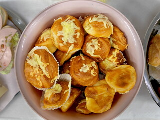 Pretzel rolls with cheese are a popular snack between meals