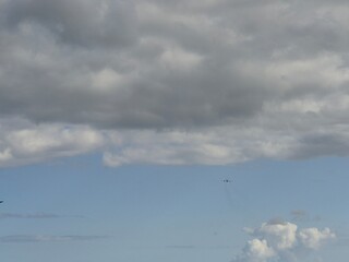 Sky with Cumulus Clouds Over Grassland and Road