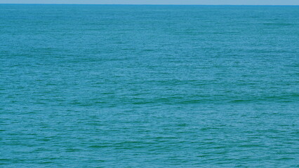 Obraz premium Never Endless Sea Surface View. Blue Crystal Clear Water. Still.