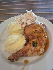 Chicken leg with mashed potatoes dish