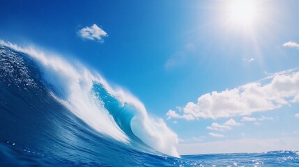 Powerful ocean wave curling under bright sun.