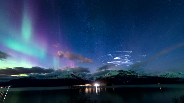 Aurora borealis in sky during Andoya Space test rockets launch, time-lapse