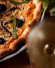 Gourmet pizza with wine