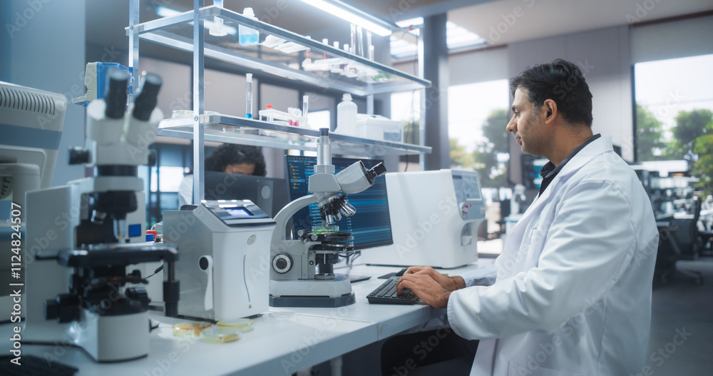 Aufkleber Molecular Biology Research Scientist Looking at a DNA Sample Under a Microscope in an Applied Science Laboratory. Portrait of an Adult Lab Engineer in White Coat Working on Vaccine and Medicine