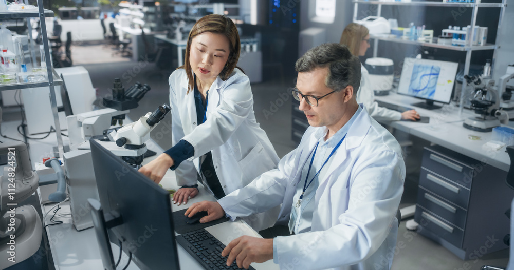 Poster asian female medical supervisor having a conversation with a caucasian scientist about a gene editin