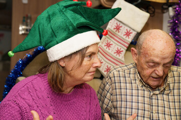 Seniors celebrating christmas holidays inside their motorhome playing a board game