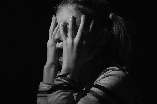 Crown of thorns and rosary beads on brown texture background with space for text