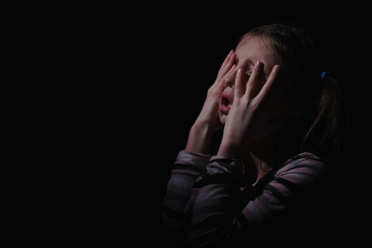 Crown of thorns and rosary beads on brown texture background with space for text