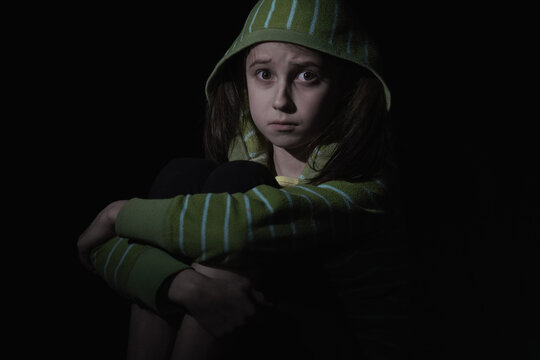 Crown of thorns and rosary beads on brown texture background with space for text