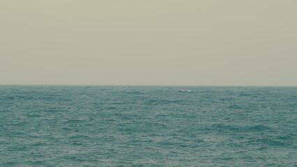 Obraz premium Powerful Ocean Waves Crushing On A Black Coast With Foamy White Texture. Waves With Foam Whitecaps And Splashes.