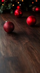 Festive red Christmas ornaments on a wooden floor with warm bokeh lights in the background. Perfect for holiday-themed designs and seasonal decorations.