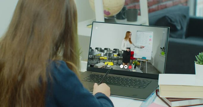 Teenager girl student study with teacher on video chat using laptop. Online lesson at home. E-learning classe, distance course and self-isolation concept at COVID-19 Pandemic.