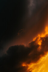 Moody storm clouds illuminated by vibrant sunset light—an inspiring backdrop for artistic or commercial use