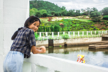 portait asian Thai girl with Overflow weir