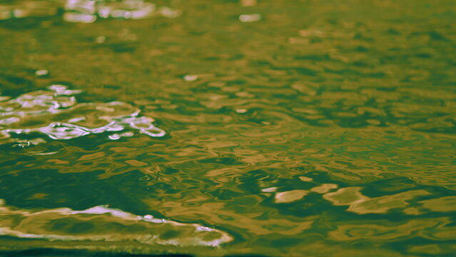 Beautiful Pattern Of Water Reflecting Sun. Beautiful Ripples On Water. Shining Light From Sun On Sea Water.