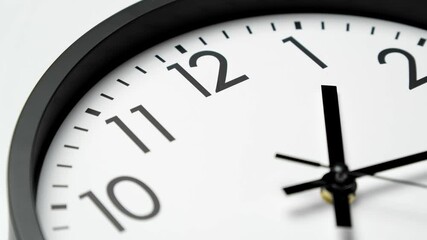 Classic wall clock. Clock face on white background. Analog clock. Time lapse. Time running fast. Wall clock show running time. Close up in 4K, UHD
