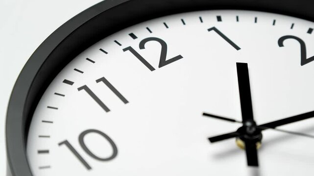 Classic wall clock. Clock face on white background. Analog clock. Time lapse. Time running fast. Wall clock show running time. Close up in 4K, UHD