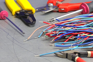 A tool for installing equipment in an electrical switchboard. Soft focus. Close-up.