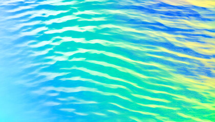 Obraz premium Waves create mesmerizing patterns in turquoise and golden sunlight reflections