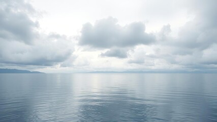 Obraz premium soft grey clouds floating on lake water surface, natural scenery, clouds, water
