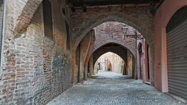 Charming Brick Arch Along the Streets of Ferrara's Jewish Ghetto: A Glimpse into the Rich History. High quality footage in 4k format
