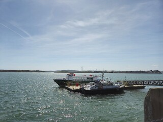 Boat on a tranquil lake under a cloudy sky