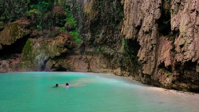 Aerial drone view Tumalog waterfall in a mountain gorge in the tropical jungle of the Philippines, Cebu. High quality 4k footage