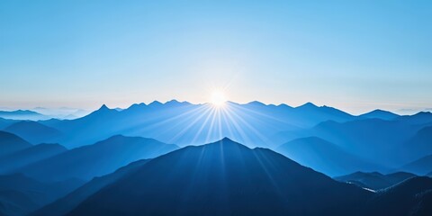 Majestic Sunrise Over Serene Mountain Landscape in Soft Blue Hues