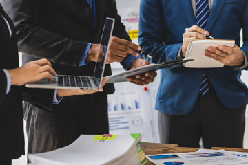 Businessman and colleagues are talking and discussing business project planning in the office.