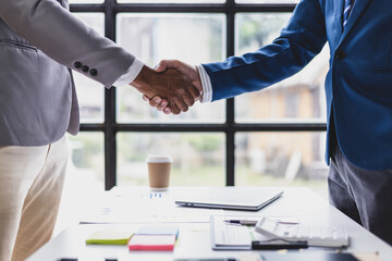 Handshake, business cooperation, Businessman shake hands in a meeting.