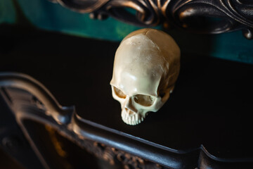 Plastic decorative skull on the fireplace or shelves, Halloween decor