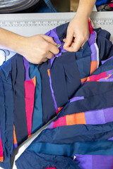 The process of sewing clothes from the remains of textiles and cut clothes. Upcycling, recycling,...
