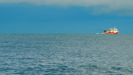 Fishing Boat On The Sea. Small Ship Floats On Sea Surface. Static View.