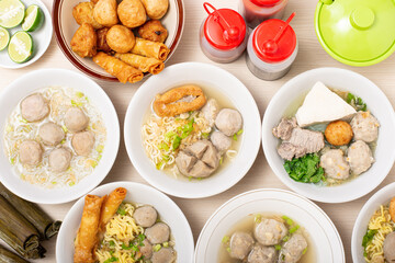 Bakso sapi, Various beef meatballs with accompaniments on wooden table. Most popular Indonesian foods