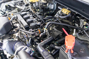 Fototapeta premium focused on the automotive industry within the contemporary new automobile engine room, machine displays all components and has an open hood. the new car's engine compartment.