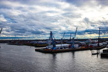 Obraz premium Port of Hamburg, Elbe River, Hamburg, Germany, view of the port, Cranes in the port