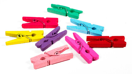 Multicolored clothespins isolated on white background.