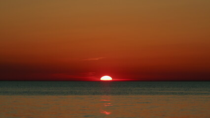 Amazing Colors Sun Setting Down Over The Ocean. Variety Of Colors And Hues Of Setting Sun. Slow...